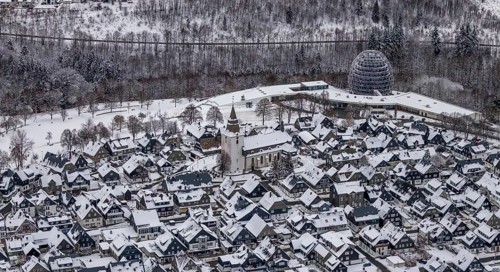 Aerial view of the snowy winter landscape of Winterberg with deserted streets during the corona