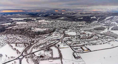 Aerial view of the snowy winter landscape of Winterberg with deserted streets during the corona