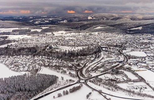 Aerial view of the snowy winter landscape of Winterberg with deserted streets during the corona