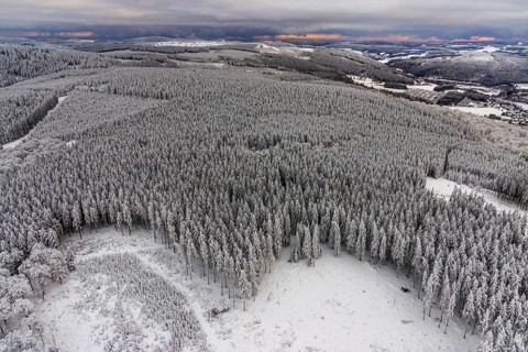 Aerial view of the snowy winter landscape of Winterberg in Sauerland in North Rhine-Westphalia,
