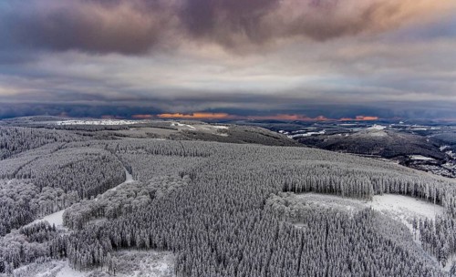 Aerial view of the snowy winter landscape of Winterberg in Sauerland in North Rhine-Westphalia,