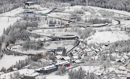 Aerial view of the snowy winter landscape of Winterberg with the VELTINS-EisArena Winterberg