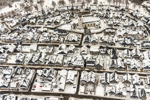 Aerial view of the snowy winter landscape of Winterberg with deserted streets during the Corona