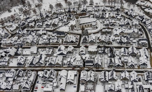 Aerial view of the snowy winter landscape of Winterberg with deserted streets during the Corona