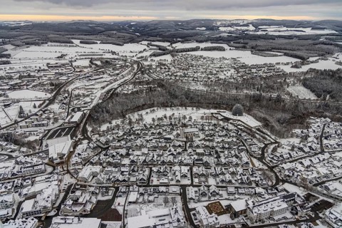 Aerial view of the snowy winter landscape of Winterberg with deserted streets during the Corona
