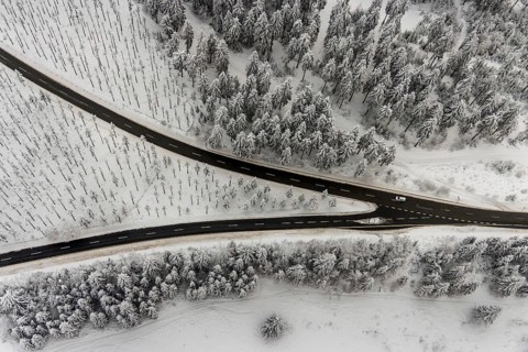 Aerial view of the snowy winter landscape of Winterberg with winding roads and paths with a