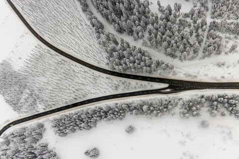 Aerial view of the snowy winter landscape of Winterberg with winding roads and paths with a
