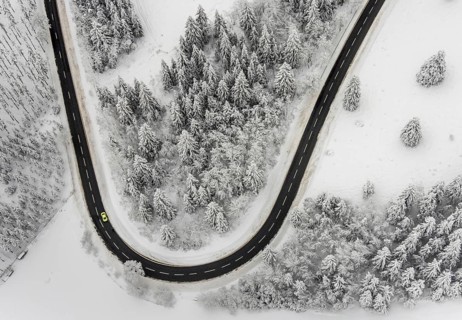 Aerial view of the snowy winter landscape of Winterberg with winding roads and paths in the