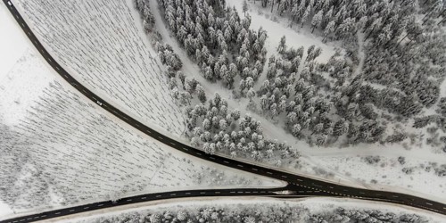 Aerial view of the snowy winter landscape of Winterberg with winding roads and paths with a