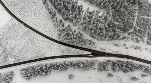 Aerial view of the snowy winter landscape of Winterberg with winding roads and paths with a