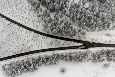 Aerial view of the snowy winter landscape of Winterberg with winding roads and paths with a
