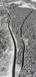 Aerial view of the snowy winter landscape of Winterberg with winding roads and paths in the