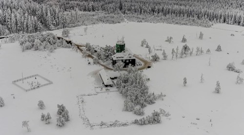 Aerial view of the snowy winter landscape of Winterberg am Kahlen Asten with Astenturm during