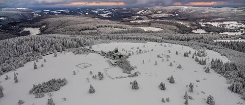 Aerial view of the snowy winter landscape of Winterberg am Kahlen Asten with Astenturm during