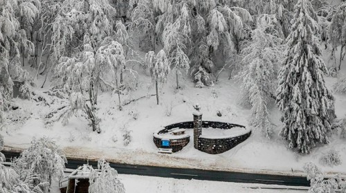 Aerial view of the snowy winter landscape of Winterberg below the Kahler Asten with snow-covered