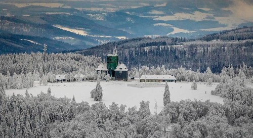 Aerial view of the snowy winter landscape of Winterberg am Kahlen Asten with Astenturm during