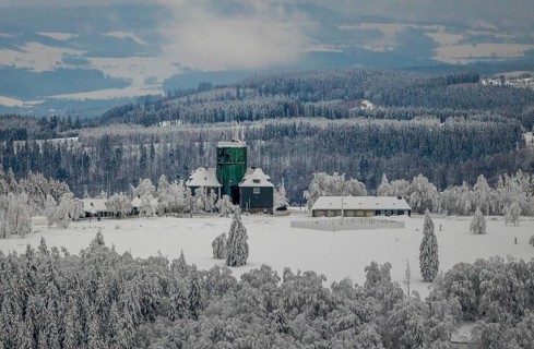 Aerial view of the snowy winter landscape of Winterberg am Kahlen Asten with Astenturm in times of