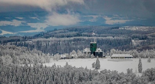 Aerial view of the snowy winter landscape of Winterberg am Kahlen Asten with Astenturm in times of
