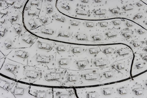 Aerial view of the snowy winter landscape of Winterberg with the deserted Landal Winterberg holiday