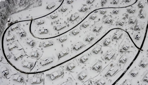 Aerial view of the snowy winter landscape of Winterberg with the deserted Landal Winterberg holiday