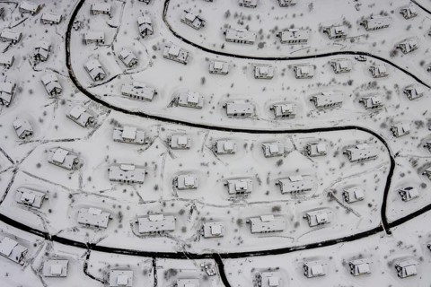 Aerial view of the snowy winter landscape of Winterberg with the deserted Landal Winterberg holiday