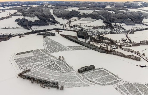 Aerial view of the snowy winter landscape of Winterberg in Sauerland in North Rhine-Westphalia,
