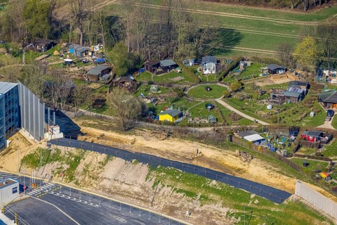 Aerial view, allotment garden site Mellmausland next to the Amazon site on the industrial estate on