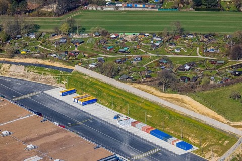 Aerial view, allotment garden site Mellmausland next to the Amazon site on the industrial estate on