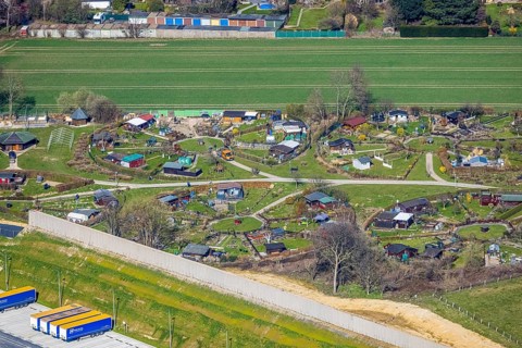 Aerial view, allotment garden site Mellmausland next to the Amazon site on the industrial estate on