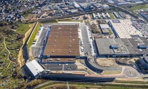 Aerial view, construction site new building Amazon logistics centre, industrial estate on