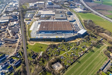 Aerial view, construction site new building Amazon logistics centre, industrial estate on