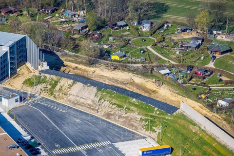 Aerial view, allotment garden site Mellmausland next to the Amazon site on the industrial estate on