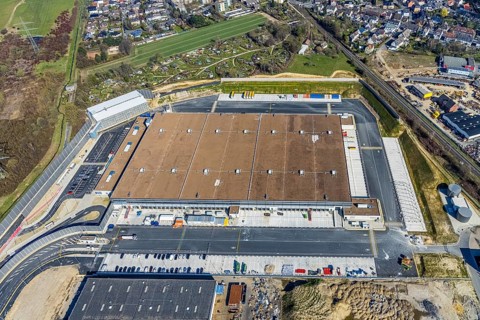 Aerial view, construction site new building Amazon logistics centre, industrial estate on
