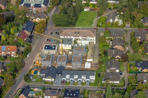Aerial view, construction site with new construction of residential buildings on the site of the