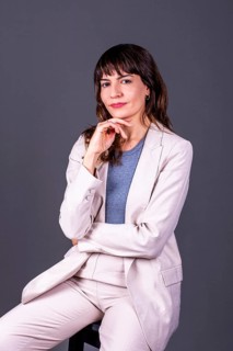Confident professional businesswoman with her hand on her chin