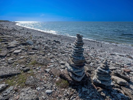 Piled up stones, on the stony Baltic Sea beach, Jordhamn, Öland, Sweden