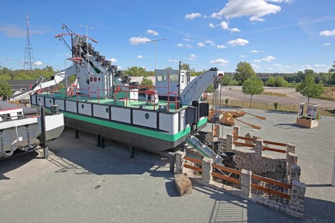 Historic dredging ship 'Otter' with shovels for dredging, open-air museum, machine, view from