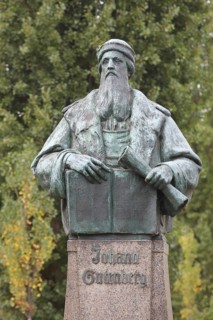 Monument to Johannes Gutenberg with book, scroll, inscription, bronze sculpture, Gutenberg