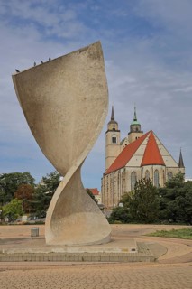 Sculpture Flag monument by Joachim Sendler 1974, late Romanesque St. Johannis Church, concrete,