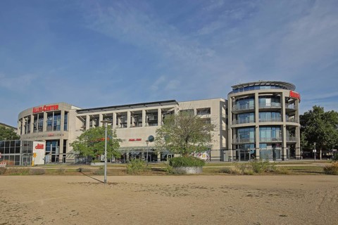 Allee-Center with flags, shopping centre, modern building, glass building, Magdeburg,