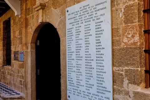 Memorial plaque with names on an old stone wall in a town, Kahal Shalom Synagogue, Sephardic
