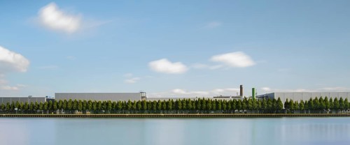 View across the Mittelland Canal to an industrial building with trees growing in front of it, long