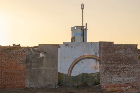 Photograph of a remaining wall of a demolished house in the evening light, Hanover, Lower Saxony,