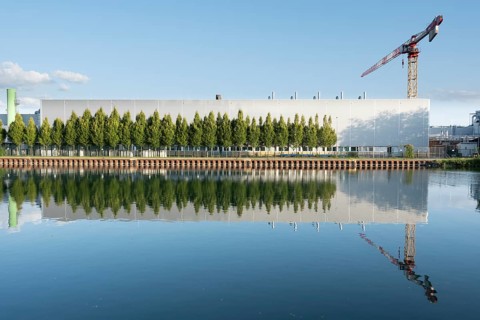 View across the Mittelland Canal to an industrial building with a crane, Garbsen, Hanover, Lower