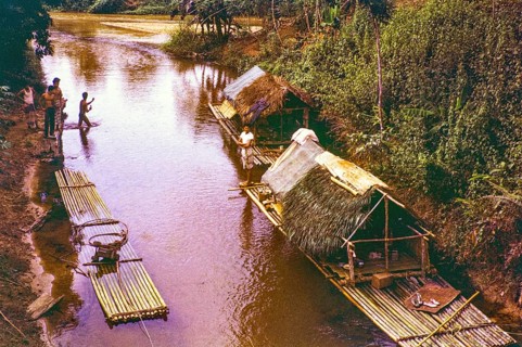 People living in homes on river house rafts, Pahnag river, Bentong district, Malaya, Malaysia,