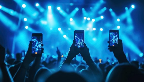 Music Fans Capture Concert Footage On Smartphones: Festival Crowd Snapping Photos On Nightclub