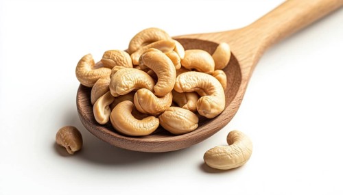 Delicious Roasted Cashew Nuts Displayed On A Wooden Spoon Against A White Background, Perfect For