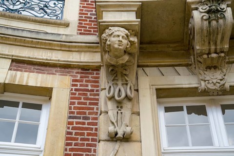 Traditional Westphalian Mettwurst sausage, detail on the facade of the Erbdrostenhof building,