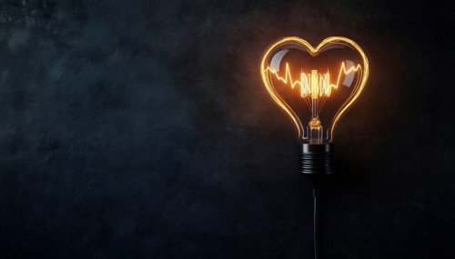 Heartbeat Form Of Electricity And Lighting: Wire Plug, Light Bulb, And Cord Shaped Like A Heartbeat