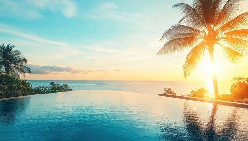 Luxurious Outdoor Infinity Pool Swimming At Beachfront Hotel Resort With Tropical Landscape And